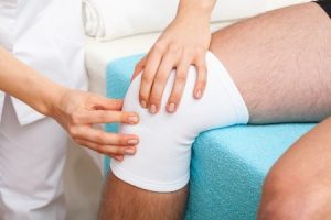 Torn knee cartilage compensation