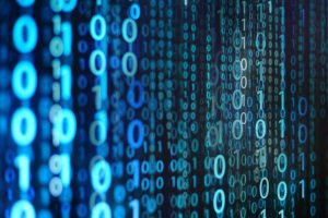 Blue binary code cascading on a black background.