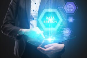 A person holding a glowing sign that says 'data breach'