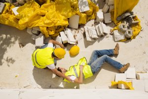 a man lying off the floor after suffering a construction injury