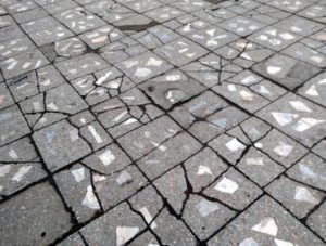 Paving tiles with multiple cracks