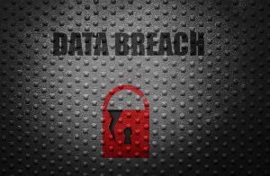 A graphic depicting a red padlock with the words 'data breach' on a grey background.