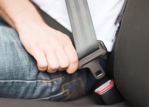Person wearing a seatbelt to represent our guide to making a passenger injury claim.