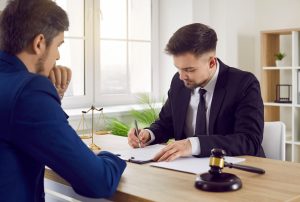 Solicitor helping a client understand how to act as a litigation friend for their injured loved one.