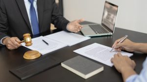 A solicitor and client discussing sepsis misdiagnosis claims.
