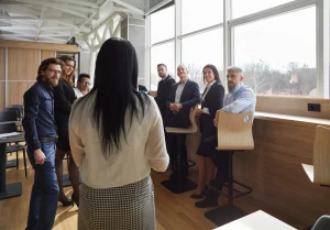 A manager holding a meeting to ensure the team have adequate training