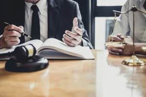 A solicitor works on a cosmetic surgery compensation claim.