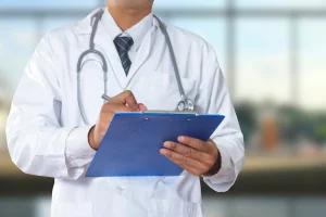 Doctor reading a patient's medical reports 