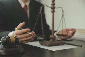 A solicitor discussing some data protection breach examples with their client in an office