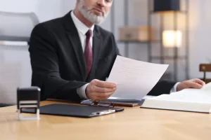 A No Win No Fee solicitor looking at MIB compensation payout examples to inform the claim that he is handling. 