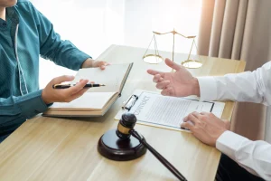 A solicitor and their client discussing a claim for a data breach by a gas company